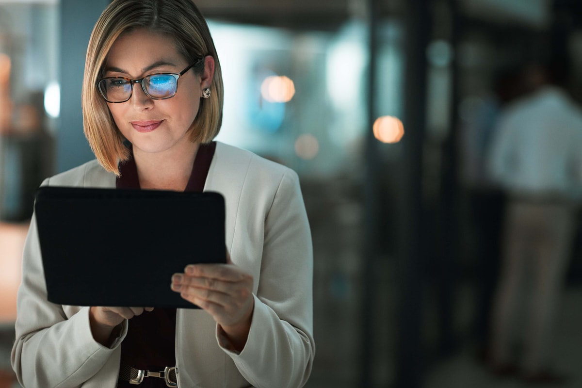 Professional woman using tablet for fleet management